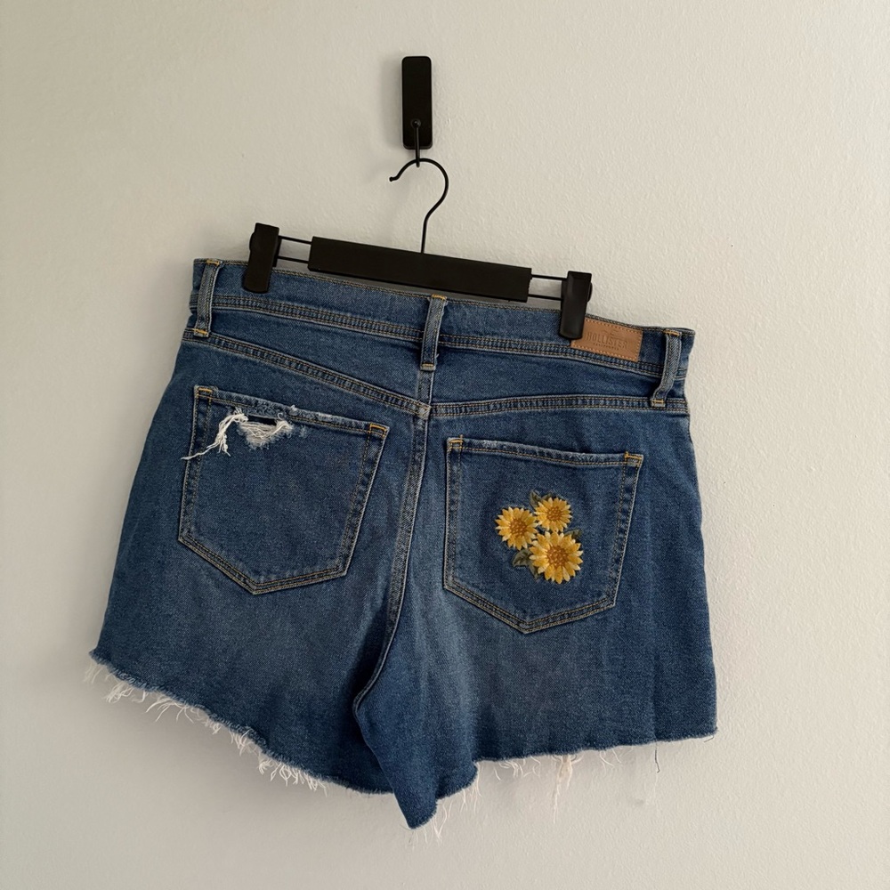 Hollister • Distressed Blue Denim Shorts with Sunflower Patch